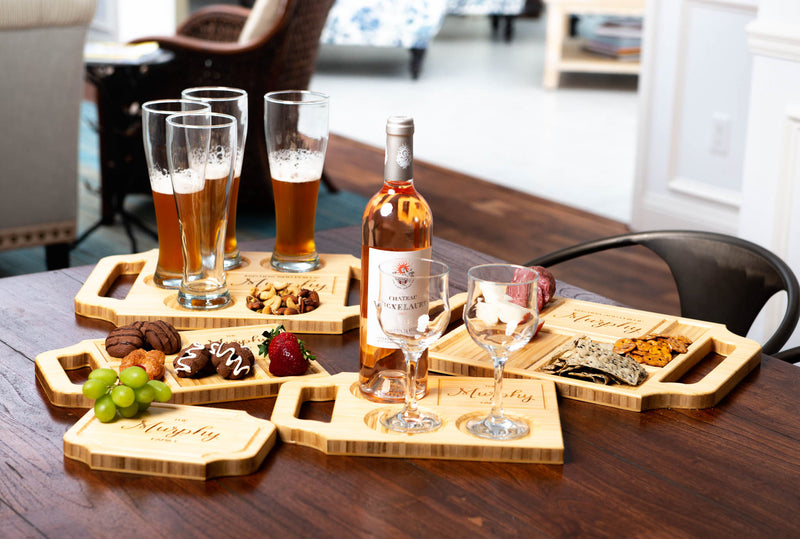 An array of Blonde-finished custom charcuterie boards and wine boards