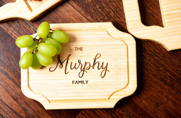 A small custom charcuterie board with family name engraving