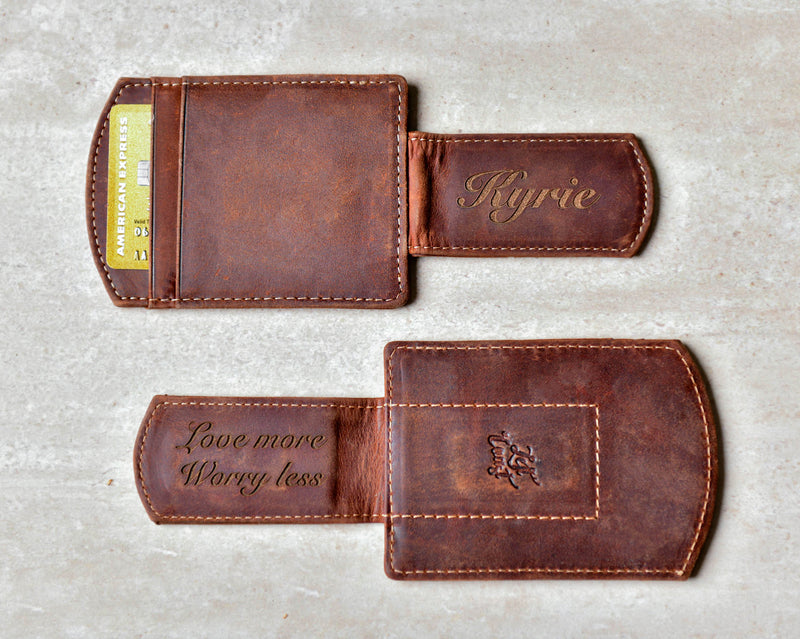 Two Super Slim Personalized Leather Magnetic Money Clips displaying the engravings on the clips