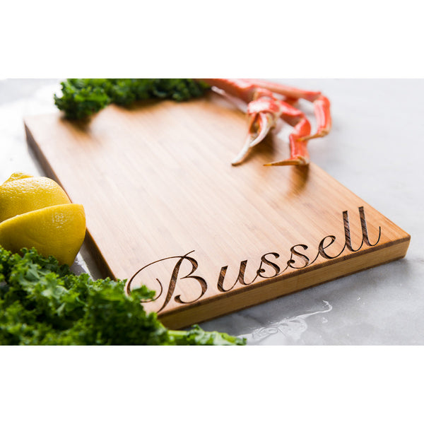 Script Font Personalized Bamboo Cutting Board with ingredients around it