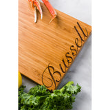 Script Font Personalized Bamboo Cutting Board with focus on the engraving